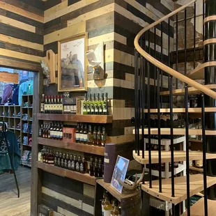 a spiral staircase in a liquor store