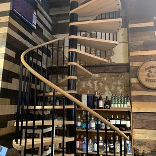 a spiral staircase in a bar