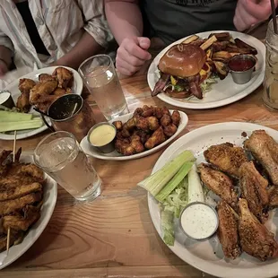 left to right: chicken strips, mango habanero wings, cheese curds, whisky burger, brown sugar bourbon wings