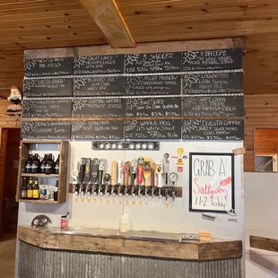 a bar with a menu on the wall