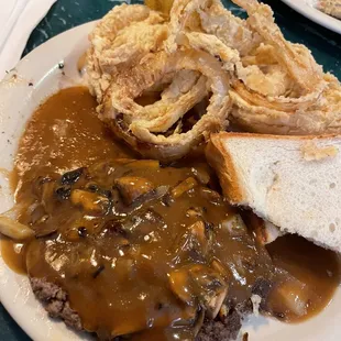 Chopped steak with onions, mushrooms, and gravy.