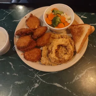 Chicken fried steak, fried pickles, mixed vegetables and texas toast