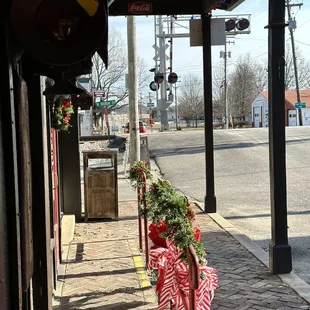 a red and white ribbon tied to a pole