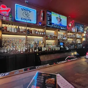 a bar with a variety of liquors