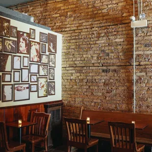 a brick wall with pictures on it