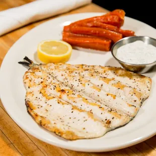 a plate of fish and carrots