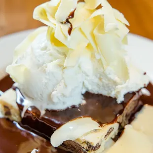 a desert with ice cream and chocolate sauce