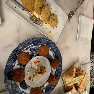 Fried green tomatoes, hush puppies, bread and butter