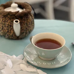 a cup of tea and a teddy bear