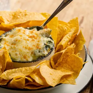 Spinach Artichoke Dip -
fresh spinach, chunky artichoke, baked parmesan, tortilla chips