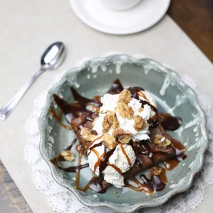 Dark Horse Hot Fudge Brownie - 
Nutella fudge brownie, house-made vanilla ice cream, chocolate, caramel, chopped nuts, whipped cream