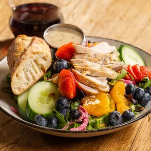 Warm Grilled Chicken 
salad with greens, pickled red onion, cotija, blueberries, strawberries, mandarins, cucumber, pecan, white balsamic