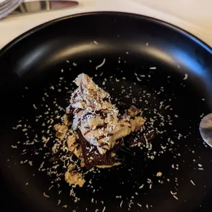 a black plate with a desert on it