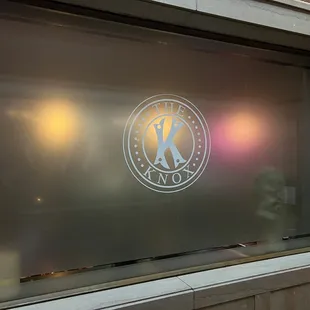 a logo on a glass window