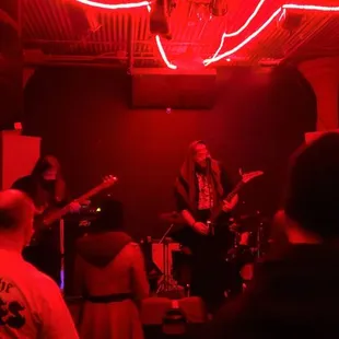 a band playing in a dimly lit room