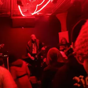 a group of people in a dimly lit room