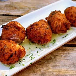 Crab Hushpuppies: honey butter ($16).