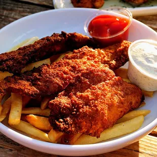 Fish and Chips: cornmeal breaded rockfish filets, fries, tartar ($21).