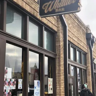 a man walking past a building