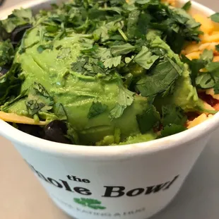 a salad in a paper cup