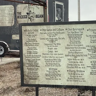 a sign in front of a building