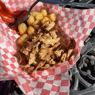 Pulled pork sandwich without the top bun (my 2 year old snagged it before I could even get my phone out to take the picture)