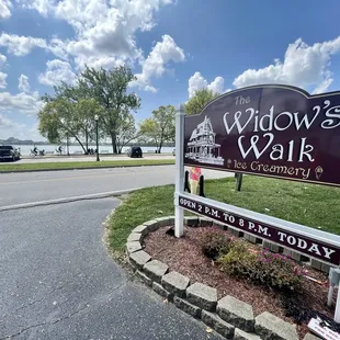 a sign in front of a road