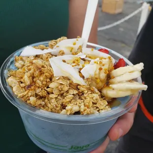 a woman holding a bowl of cereal