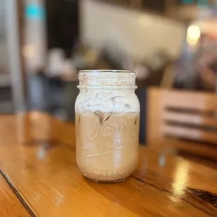 a jar of coffee on a table