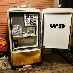 Refrigerator with books outdoors