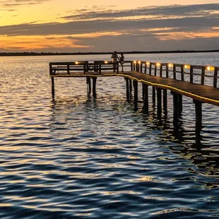a pier at sunset
