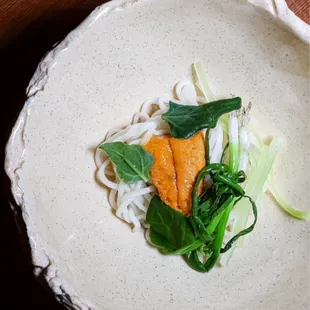 Sea urchin noodles, celtuse, charcoal-scented black garlic, unit broth (@joeynht)