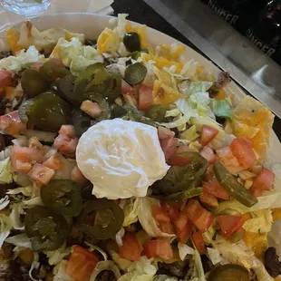 a plate of nachos with sour sour sour sour sour sour sour sour sour sour sour sour sour sour sour sour