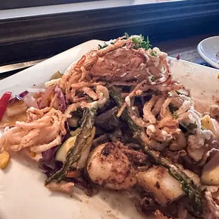 Chef&apos;s special surf and turf (scallops and sirloin with mushroom risotto and asparagus topped with fried onion tanglers