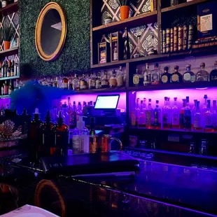 a bar with purple lighting