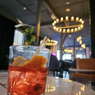 a drink in a glass on a table