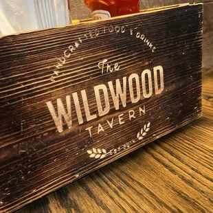 a wooden sign on a table