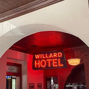 people sitting at tables in a restaurant