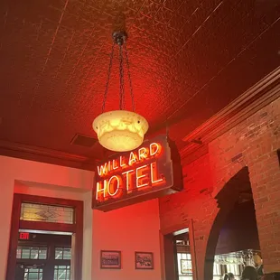 a neon sign hanging from the ceiling