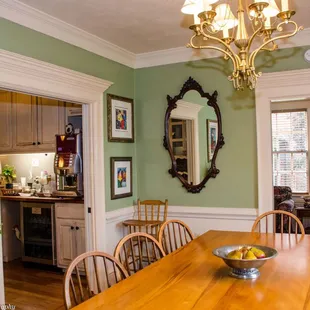 The dining room table is large enough for a crowd and big enough for social distancing