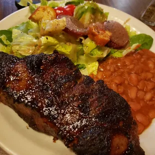a plate of meat and beans