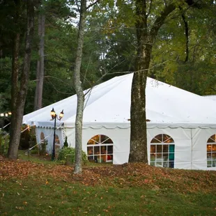 a tent set up in the woods