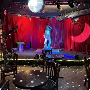 a stage with a woman on a stage