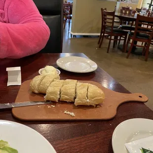 A warm loaf of bread and soft, usable butter