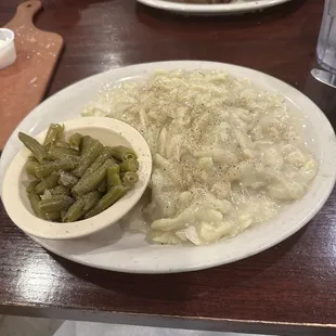 Homemade mashed potatoes and noodles, green beans. Also prime rib, macaroni and cheese with onion rings.