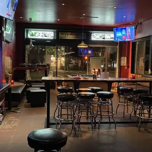 a bar with a lot of stools