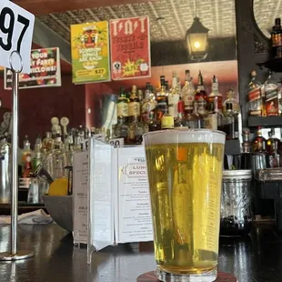 a pint of beer on the bar