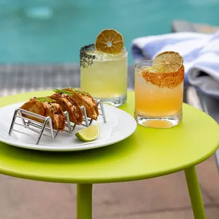 Tuna Poke Nachos and Fresh Cocktails served by the pool