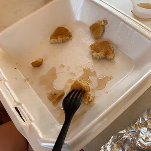 half eaten food in a styrofoam container