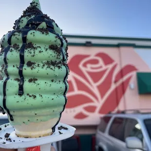 Mint cookies and cream ice cream cone.